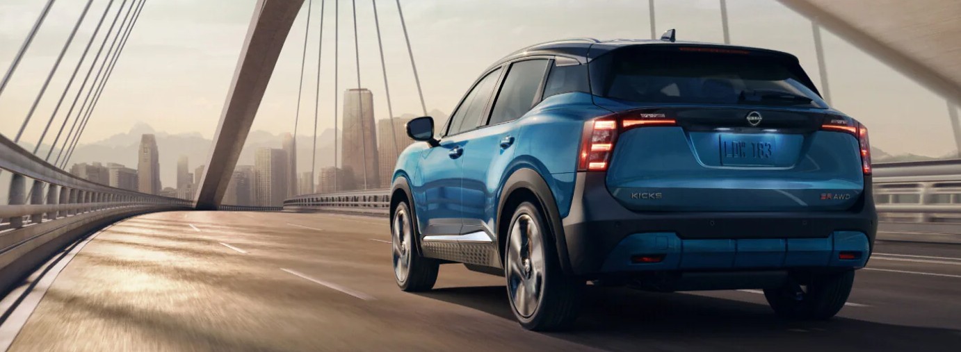 2025 Nissan Kicks driving on highway bridge